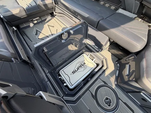 Slide: The Image of 2023 Supra SL550 interior with storage compartment and seating. - 21