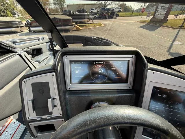 Slide: The Image of Interior view of a 2023 Supra SL550 with digital dashboard. - 22