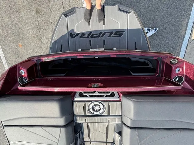 Slide: The Image of Top view of a 2023 Supra SL550 boat deck with storage. - 26
