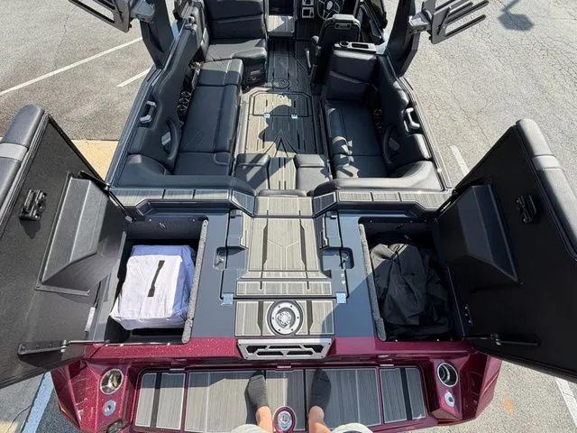 Slide: The Image of Interior of 2023 Supra SL550 with open storage compartments. - 28