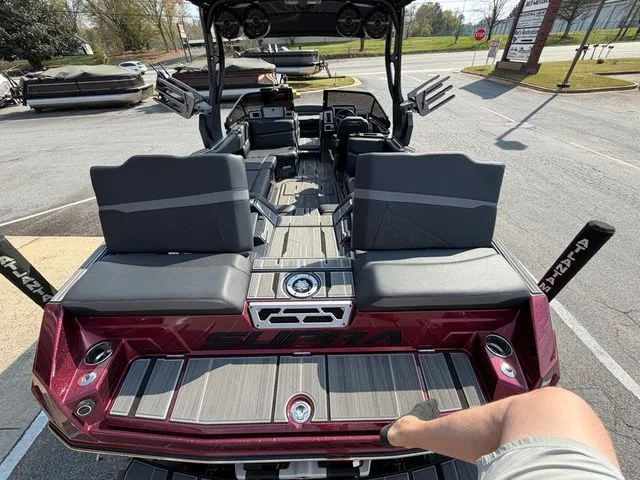 Slide: The Image of Interior view of a 2023 Supra SL550 boat with modern seating. - 29