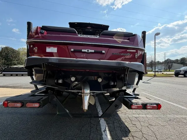 Slide: The Image of Red 2023 Supra SL550 boat on trailer, rear view. - 7