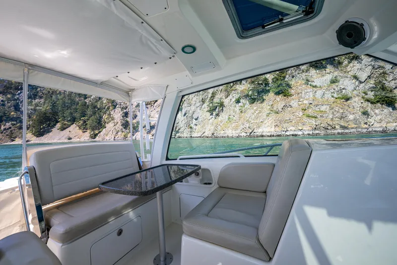 Slide: The Image of Interior of 2019 Boston Whaler 345 Conquest with scenic ocean view. - 12