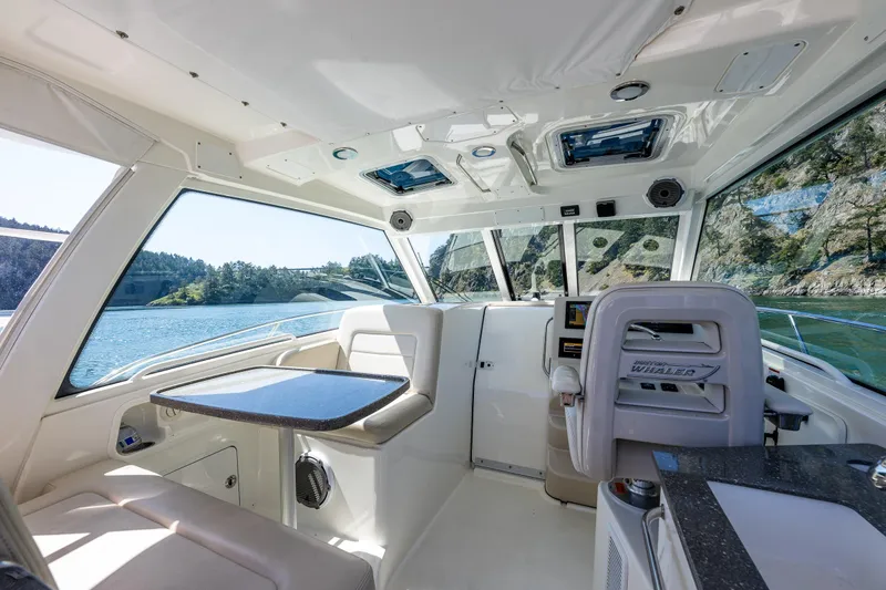 Slide: The Image of Interior of 2019 Boston Whaler 345 Conquest boat with scenic water view. - 13