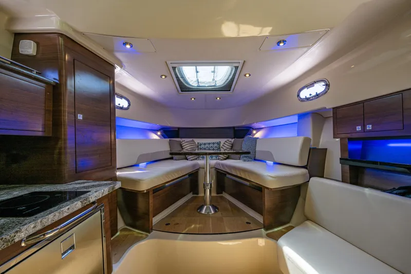 Slide: The Image of Luxurious interior of 2019 Boston Whaler 345 Conquest boat with seating and ambient lighting. - 15
