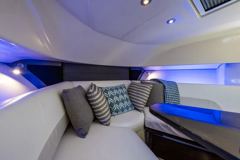 Slide: The Image of Luxurious interior of 2019 Boston Whaler 345 Conquest with plush seating and ambient lighting. - 16