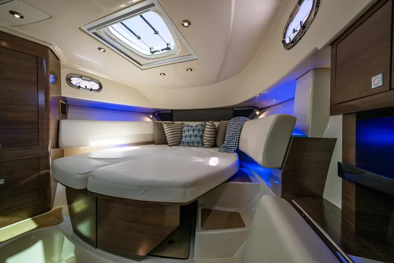 Slide: The Image of Luxurious interior of 2019 Boston Whaler 345 Conquest with plush seating and ambient lighting. - 17