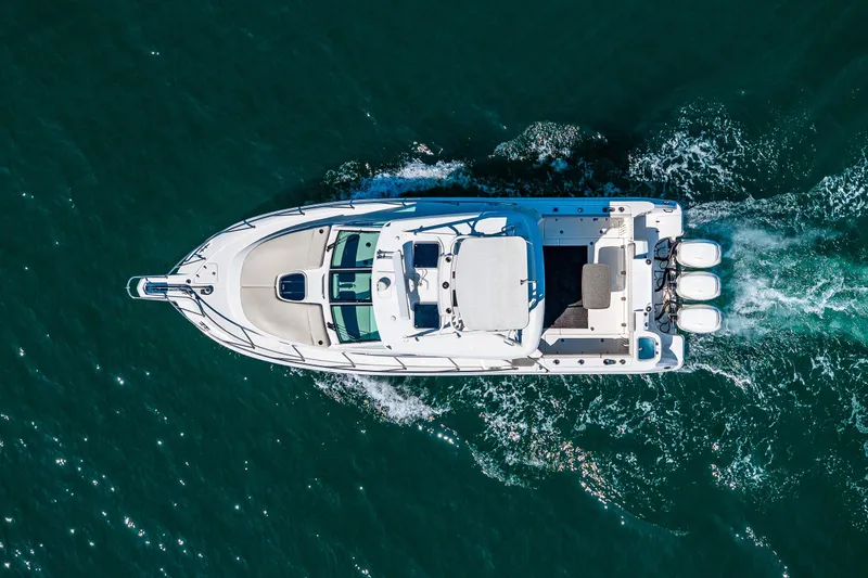 Slide: The Image of Aerial view of 2019 Boston Whaler 345 Conquest cruising on open water. - 5