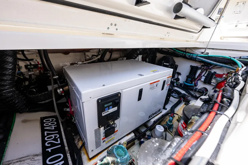 Slide: The Image of Engine compartment of 2019 Boston Whaler 345 Conquest with Kohler generator and wiring. - 8