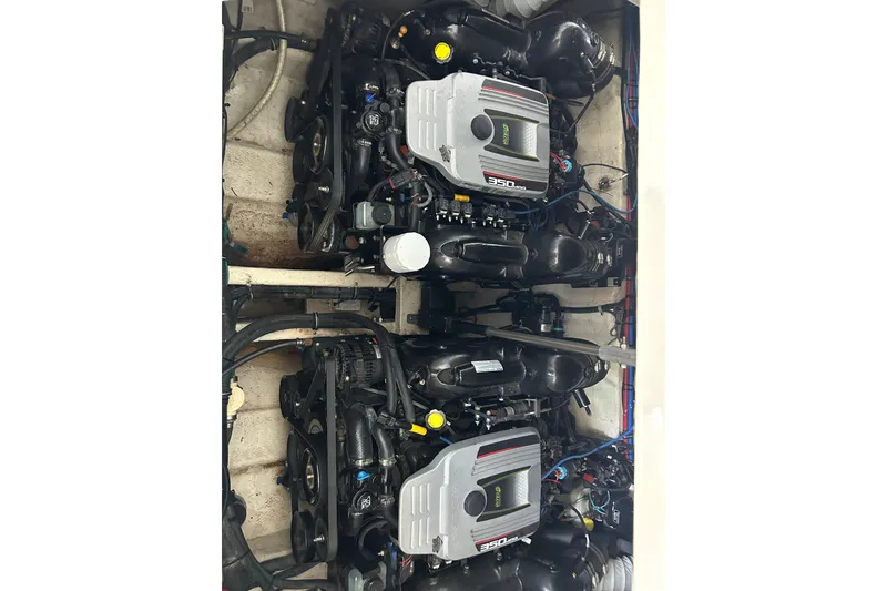 Slide: The Image of Engine compartment of a 2013 Rinker 310 Express Cruiser with twin 350 MAG engines. - 18