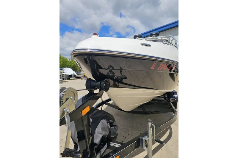 Slide: The Image of 2007 Yamaha Boats AR230 HO on trailer, parked outdoors under cloudy sky. - 15