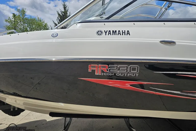 Slide: The Image of 2007 Yamaha AR230 HO boat side view with logo and graphics. - 22