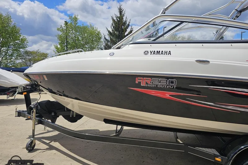 Slide: The Image of 2007 Yamaha AR230 HO boat on trailer, sleek design with vibrant graphics. - 23