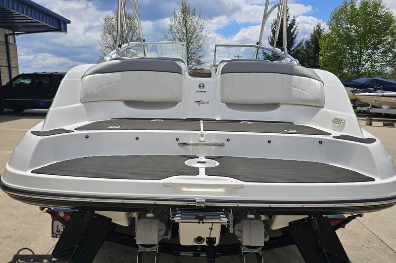 Slide: The Image of 2007 Yamaha Boats AR230 HO, rear view, docked with swim platform and seating. - 29