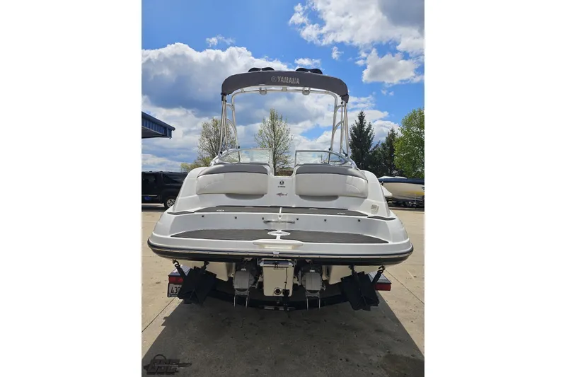 Slide: The Image of 2007 Yamaha Boats AR230 HO, rear view, parked outdoors under a partly cloudy sky. - 30