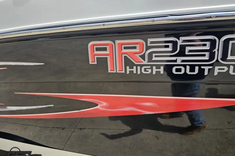 Slide: The Image of 2007 Yamaha Boats AR230 HO logo with red and black design. - 33
