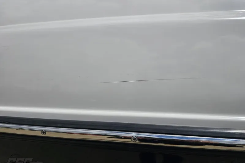 Slide: The Image of 2007 Yamaha Boats AR230 HO hull with visible scratch and chrome trim. - 35