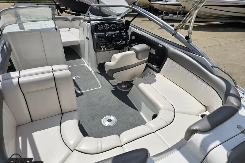 Slide: The Image of 2007 Yamaha Boats AR230 HO interior with spacious seating and modern dashboard. - 39