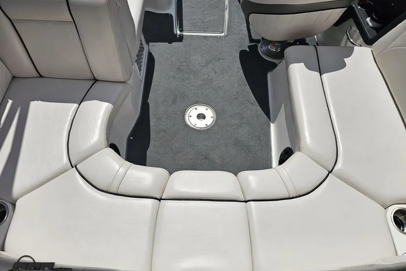 Slide: The Image of 2007 Yamaha Boats AR230 HO interior with white seating and gray carpet flooring. - 42
