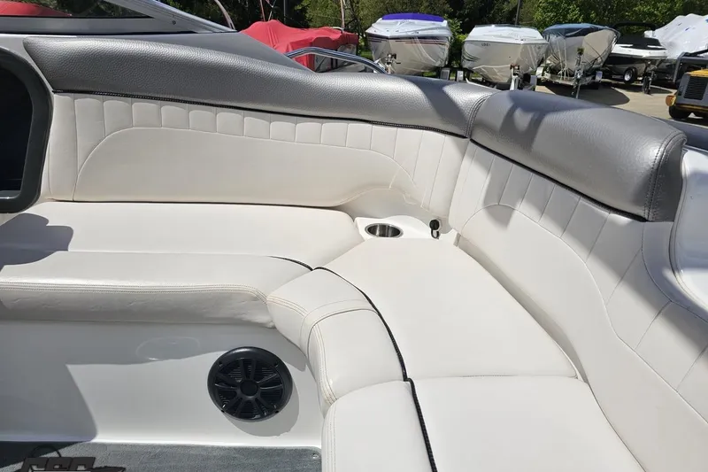 Slide: The Image of Interior seating of a 2007 Yamaha Boats AR230 HO, featuring white and gray upholstery. - 44