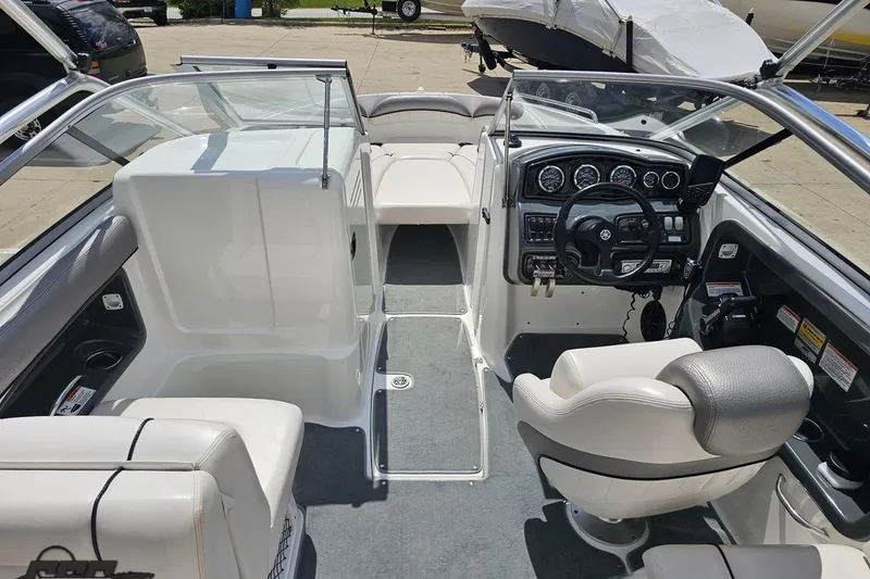 Slide: The Image of 2007 Yamaha Boats AR230 HO interior with steering wheel, seating, and dashboard controls. - 49