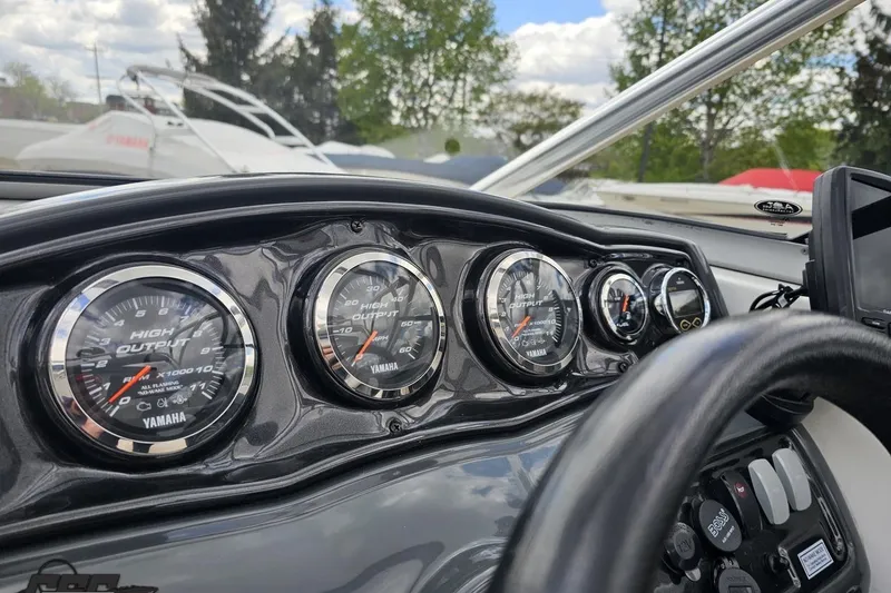 Slide: The Image of Dashboard of a 2007 Yamaha Boats AR230 HO with gauges and steering wheel. - 59