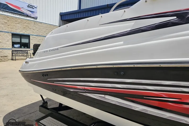 Slide: The Image of 2007 Yamaha Boats AR230 HO with twin engine, displayed outdoors. - 6