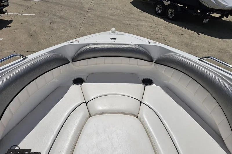 Slide: The Image of 2007 Yamaha Boats AR230 HO bow seating area with white and gray upholstery. - 65