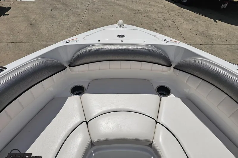 Slide: The Image of 2007 Yamaha Boats AR230 HO bow seating area with cushioned seats and cup holders. - 68