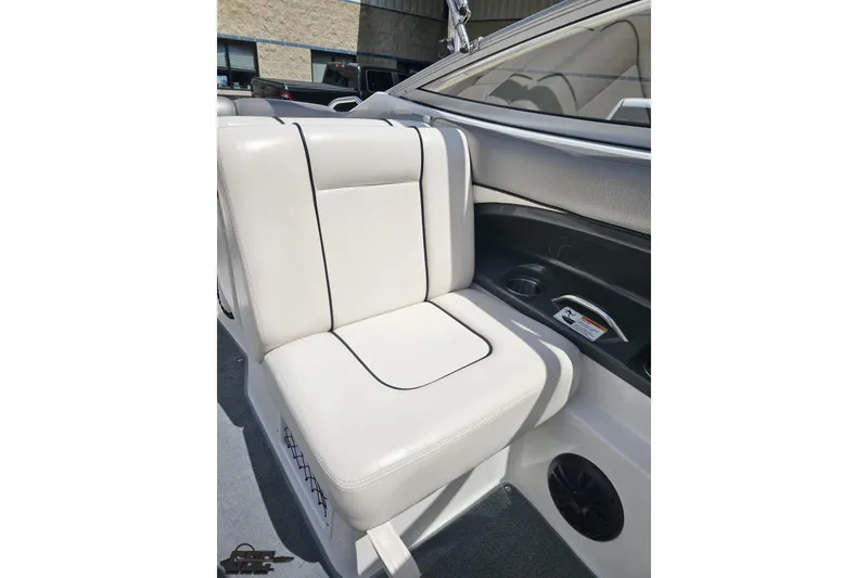 Slide: The Image of 2007 Yamaha Boats AR230 HO interior seat with white upholstery and black trim. - 74
