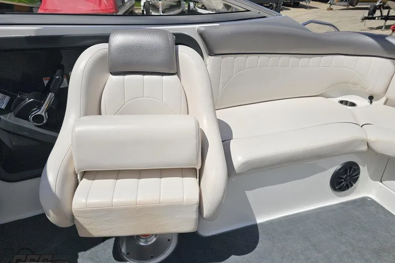 Slide: The Image of 2007 Yamaha Boats AR230 HO interior with white seating and steering controls. - 75
