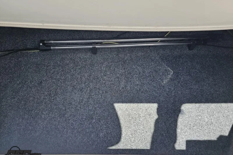 Slide: The Image of 2007 Yamaha Boats AR230 HO interior carpet with storage compartment and metal railings. - 81