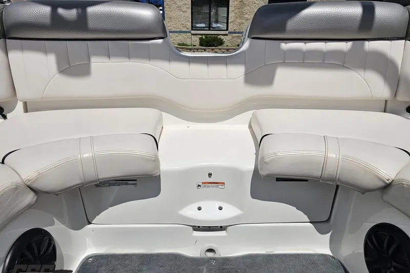 Slide: The Image of 2007 Yamaha Boats AR230 HO interior seating with white and gray upholstery. - 82