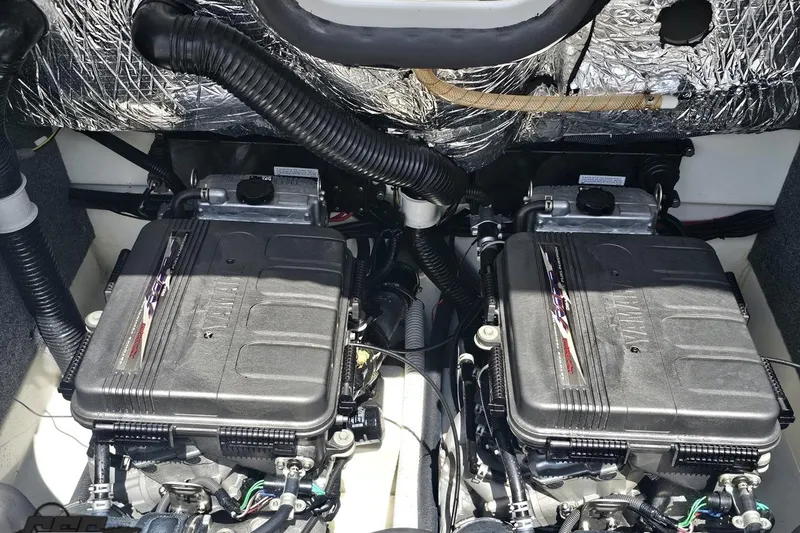 Slide: The Image of Twin engines of a 2007 Yamaha Boats AR230 HO, showcasing detailed components. - 84