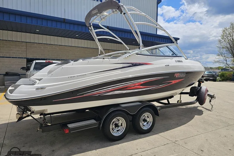Slide: The Image of 2007 Yamaha AR230 HO boat on trailer, parked outdoors. - 9