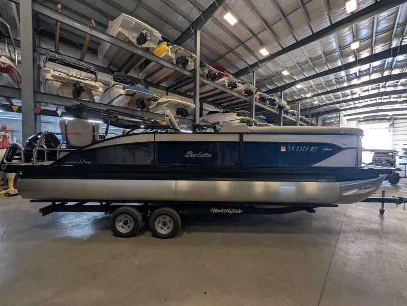 The Image of 2025 Barletta Cabrio 24CC pontoon boat in storage facility. - 1