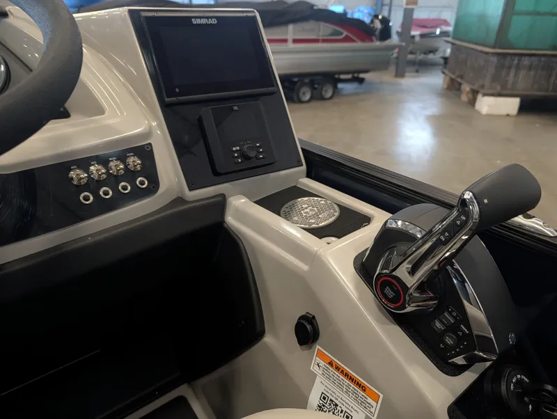 Slide: The Image of Interior view of Barletta Cabrio 24CC 2025 helm with Simrad display. - 15
