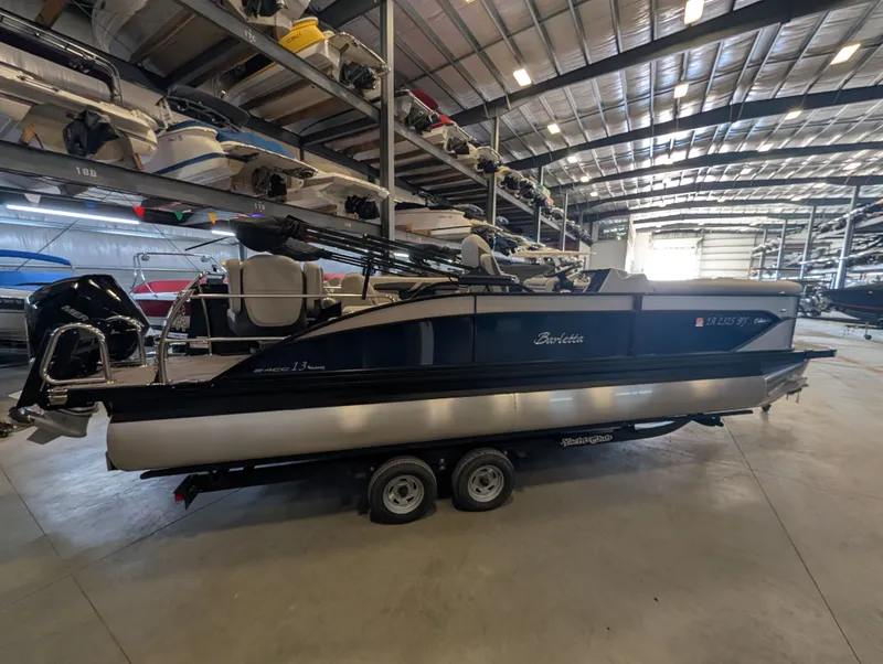 Slide: The Image of 2025 Barletta Cabrio 24CC pontoon boat in storage facility. - 5