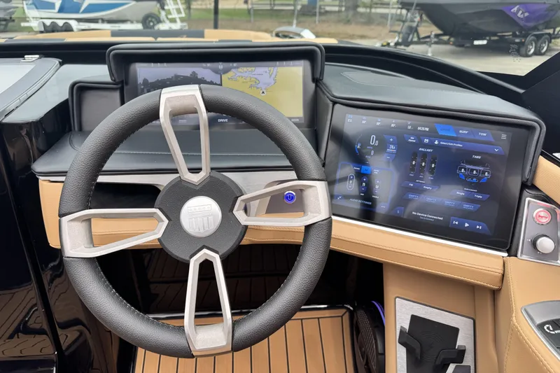 Slide: The Image of 2025 MasterCraft X26 dashboard with advanced touchscreen controls and navigation display. - 12