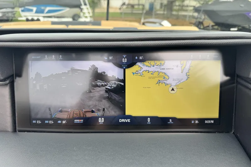 Slide: The Image of 2025 MasterCraft X26 dashboard display showing navigation and rear camera view. - 13