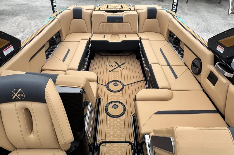 Slide: The Image of Luxurious interior of 2025 MasterCraft X26 boat with tan seating and stylish design. - 16