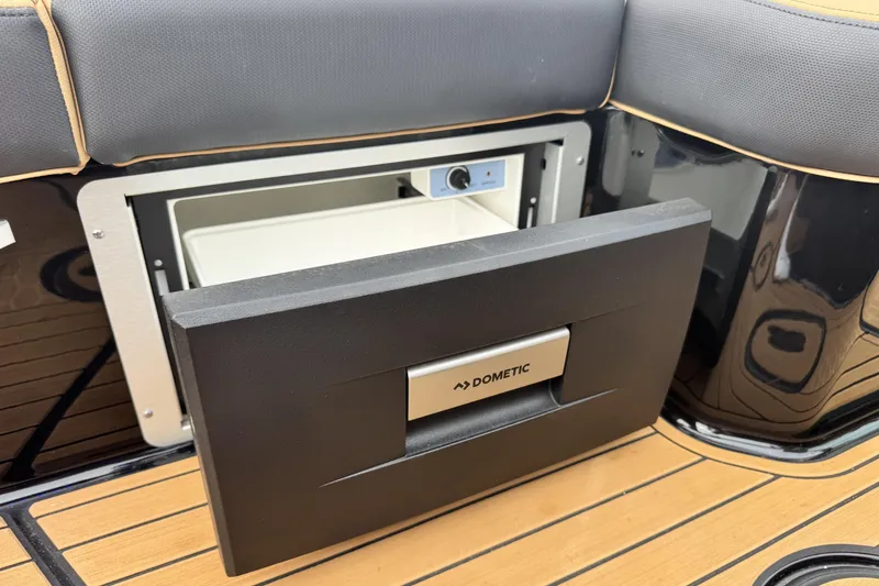 Slide: The Image of 2025 MasterCraft X26 boat with Dometic drawer fridge on teak deck. - 22