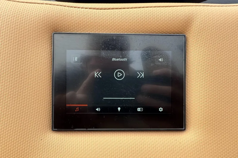 Slide: The Image of Touchscreen control panel in 2025 MasterCraft X26 boat, displaying Bluetooth audio interface. - 23