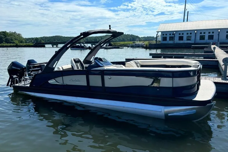 The Image of 2025 Barletta L25UCAT pontoon boat docked on a sunny day. - 1