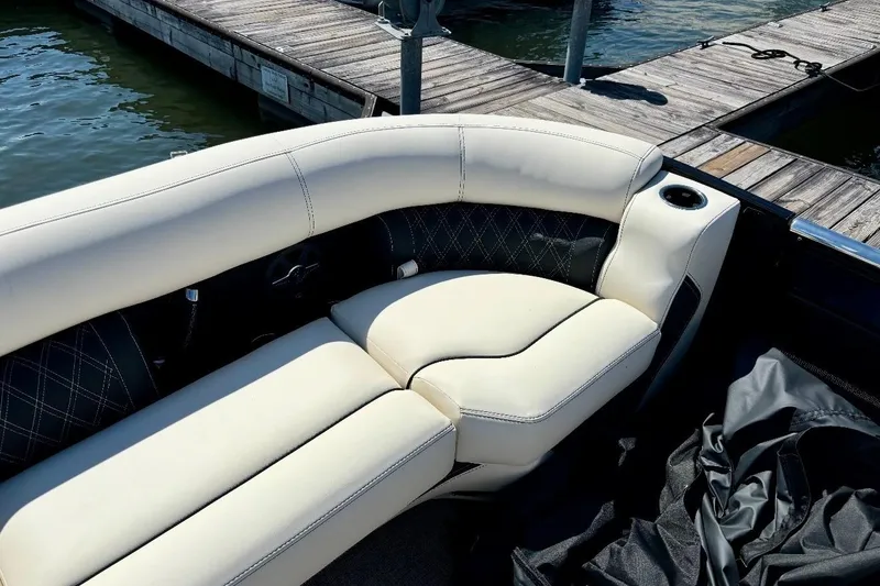 Slide: The Image of Luxurious seating on 2025 Barletta L25UCAT pontoon boat at dockside. - 13
