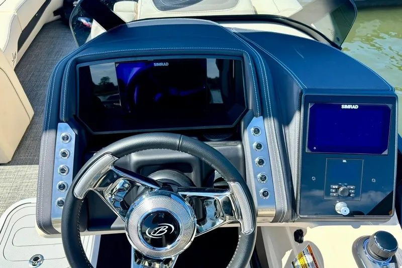 Slide: The Image of Steering console of 2025 Barletta L25UCAT boat with Simrad displays. - 9