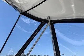 Slide: The Image of 2007 Sea Ray 36 Sedan Bridge interior view with clear sky background. - 3