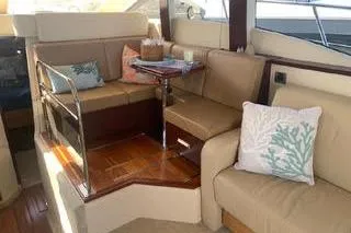 Slide: The Image of 2007 Sea Ray 36 Sedan Bridge yacht kitchen with modern appliances and sleek cabinetry. - 6