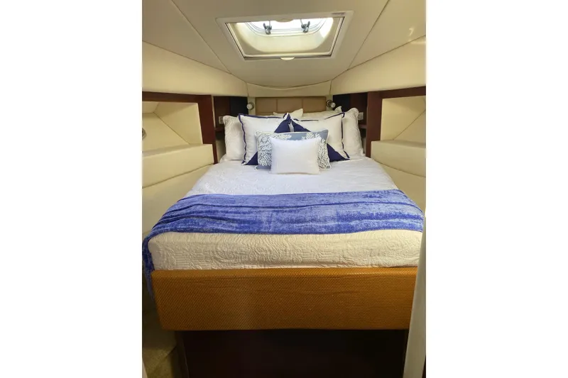 Slide: The Image of Luxurious bedroom interior of 2007 Sea Ray 36 Sedan Bridge yacht. - 8