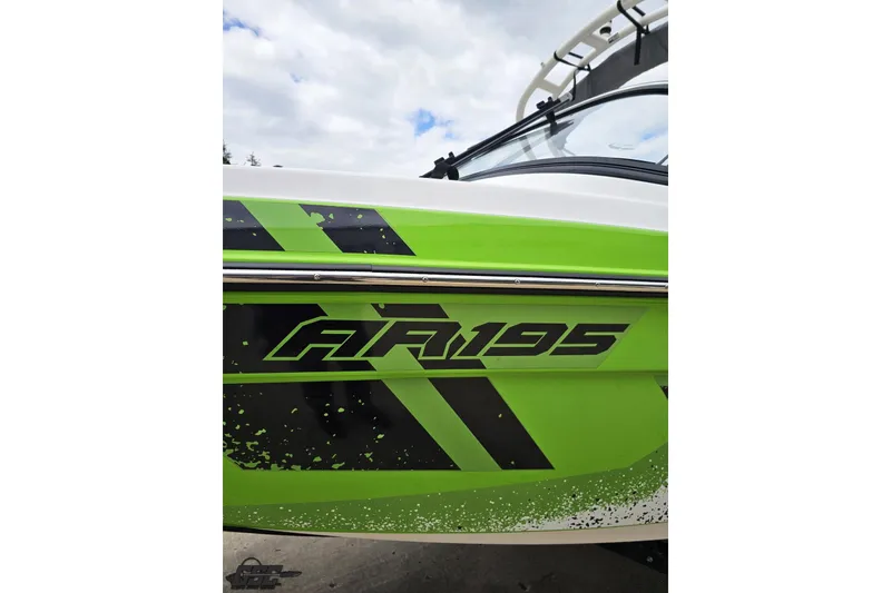 Slide: The Image of 2022 Yamaha Boats AR195 with vibrant green and black graphics. - 26